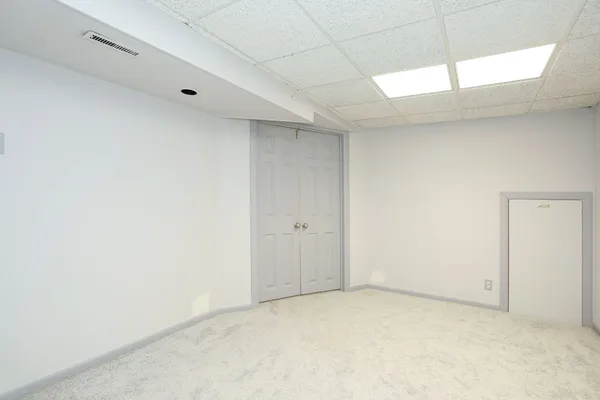 a view of a chairs and table in patio