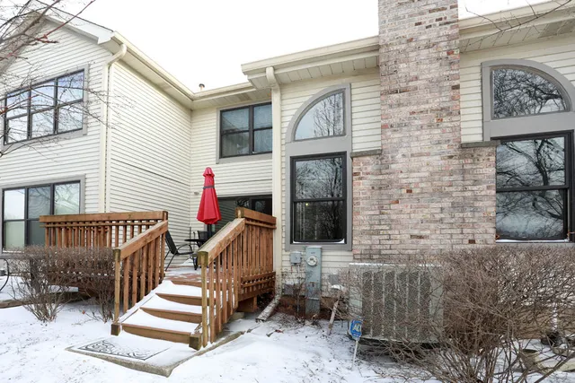 a view of a chairs and table in the patio