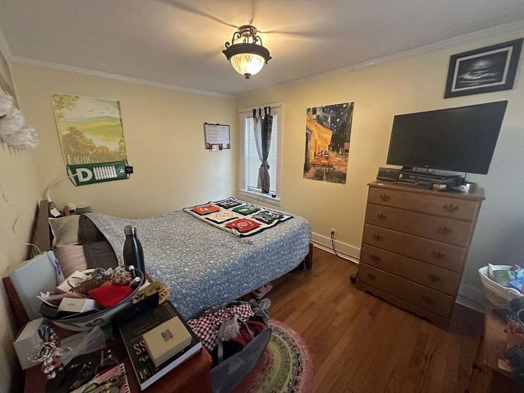 66 Summer Street, Unit 2 Natick, MA 01760 - Photo 12 of 20 a bedroom with a bed and furniture