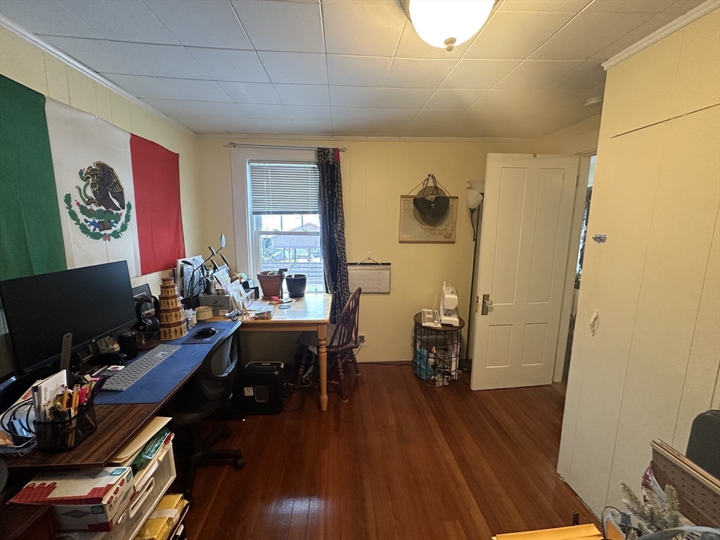 66 Summer Street, Unit 2 Natick, MA 01760 - Photo 15 of 20 a view of a workspace with furniture and wooden floor