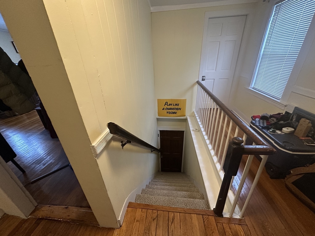 66 Summer Street, Unit 2 Natick, MA 01760 - Photo 17 of 20 a view of entryway and hall with wooden floor
