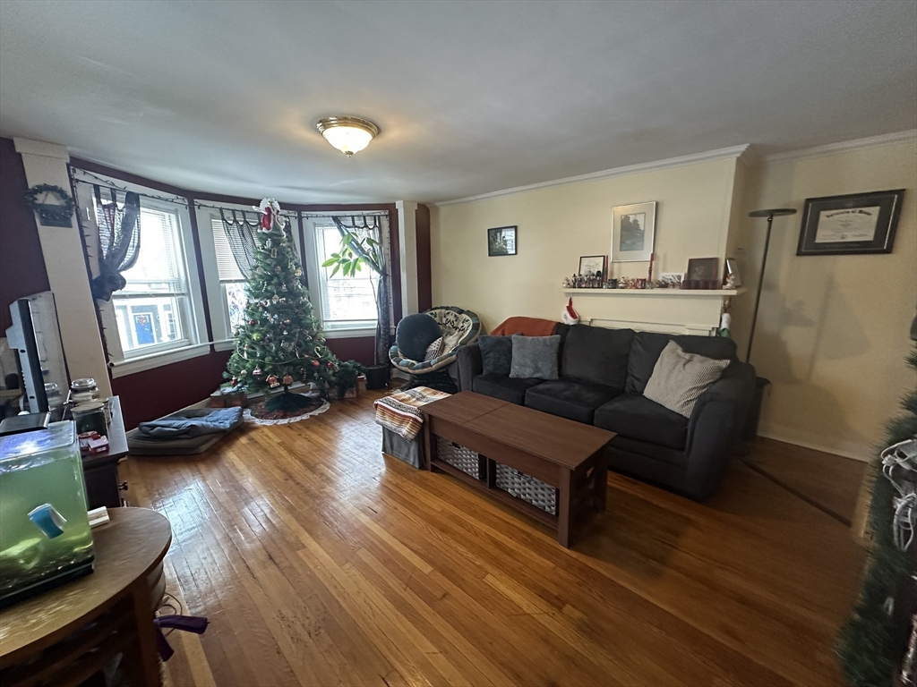 66 Summer Street, Unit 2 Natick, MA 01760 - Photo 3 of 20 a living room with furniture and a wooden floor
