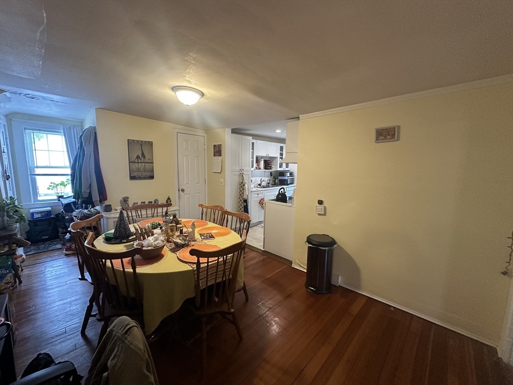 66 Summer Street, Unit 2 Natick, MA 01760 - Photo 7 of 20 a view of a dining room with furniture and wooden floor