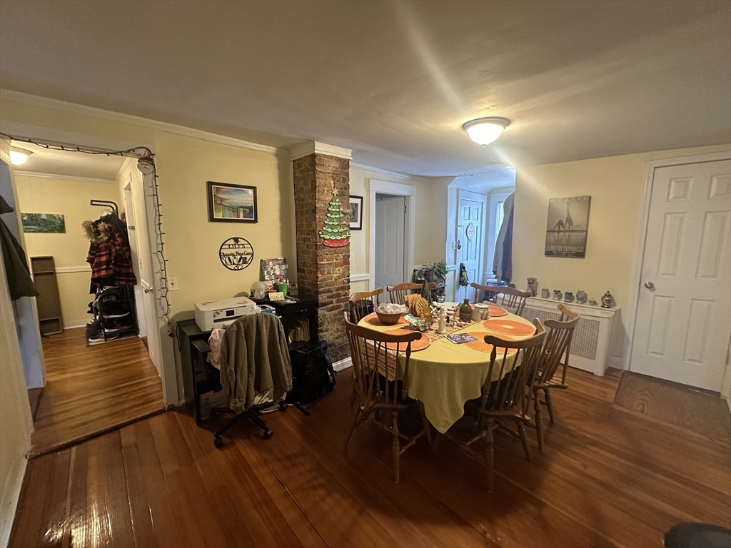 66 Summer Street, Unit 2 Natick, MA 01760 - Photo 8 of 20 a view of a a dining room with furniture window and wooden floor
