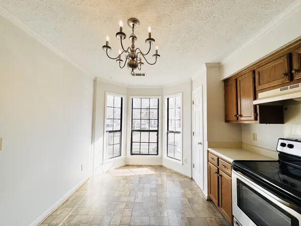 a view of a kitchen with a sink cabinets and a window