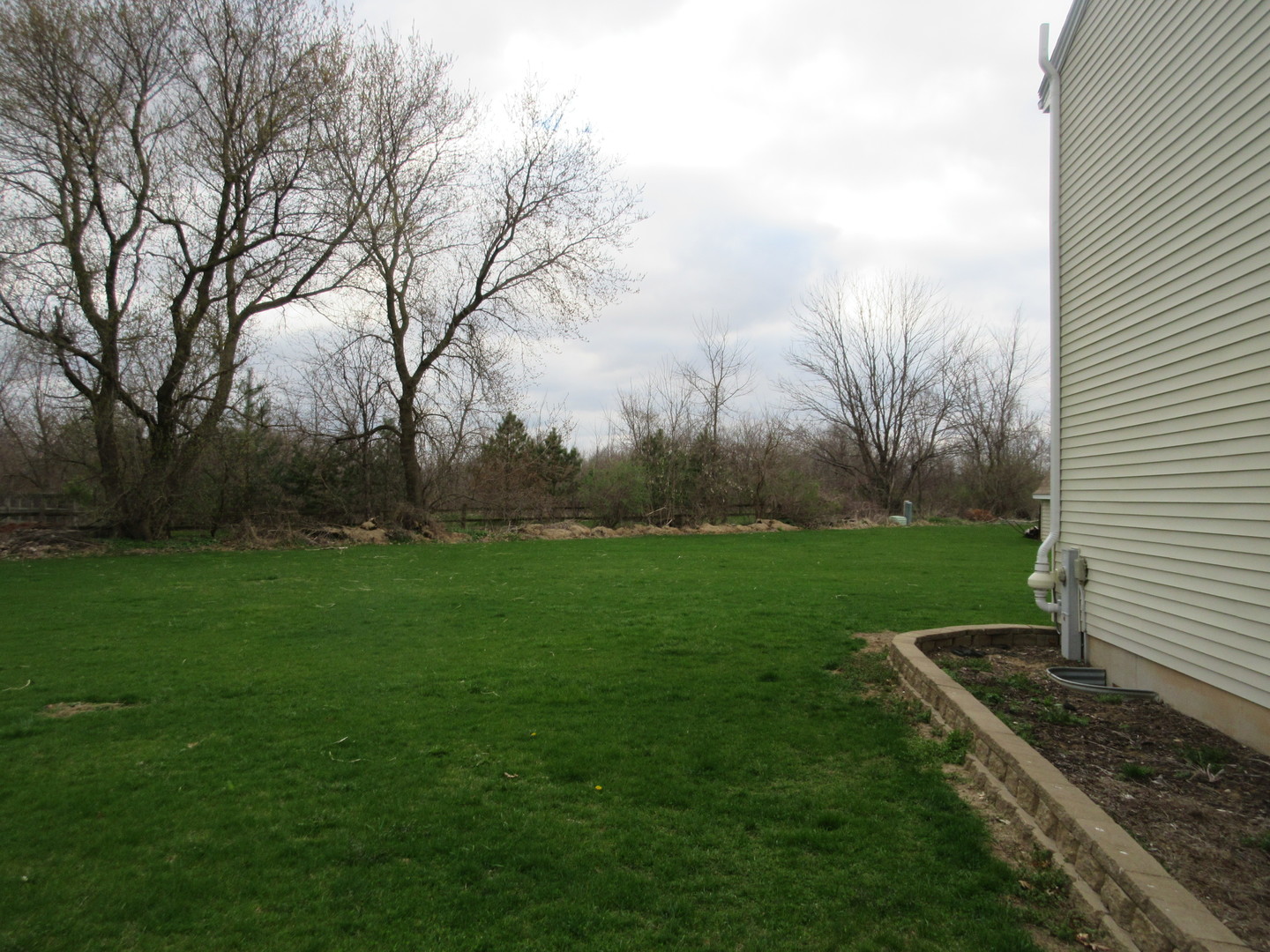 28081 Indian Point Road Sycamore, IL 60178 - Photo 22 of 24 a view of a backyard with garden