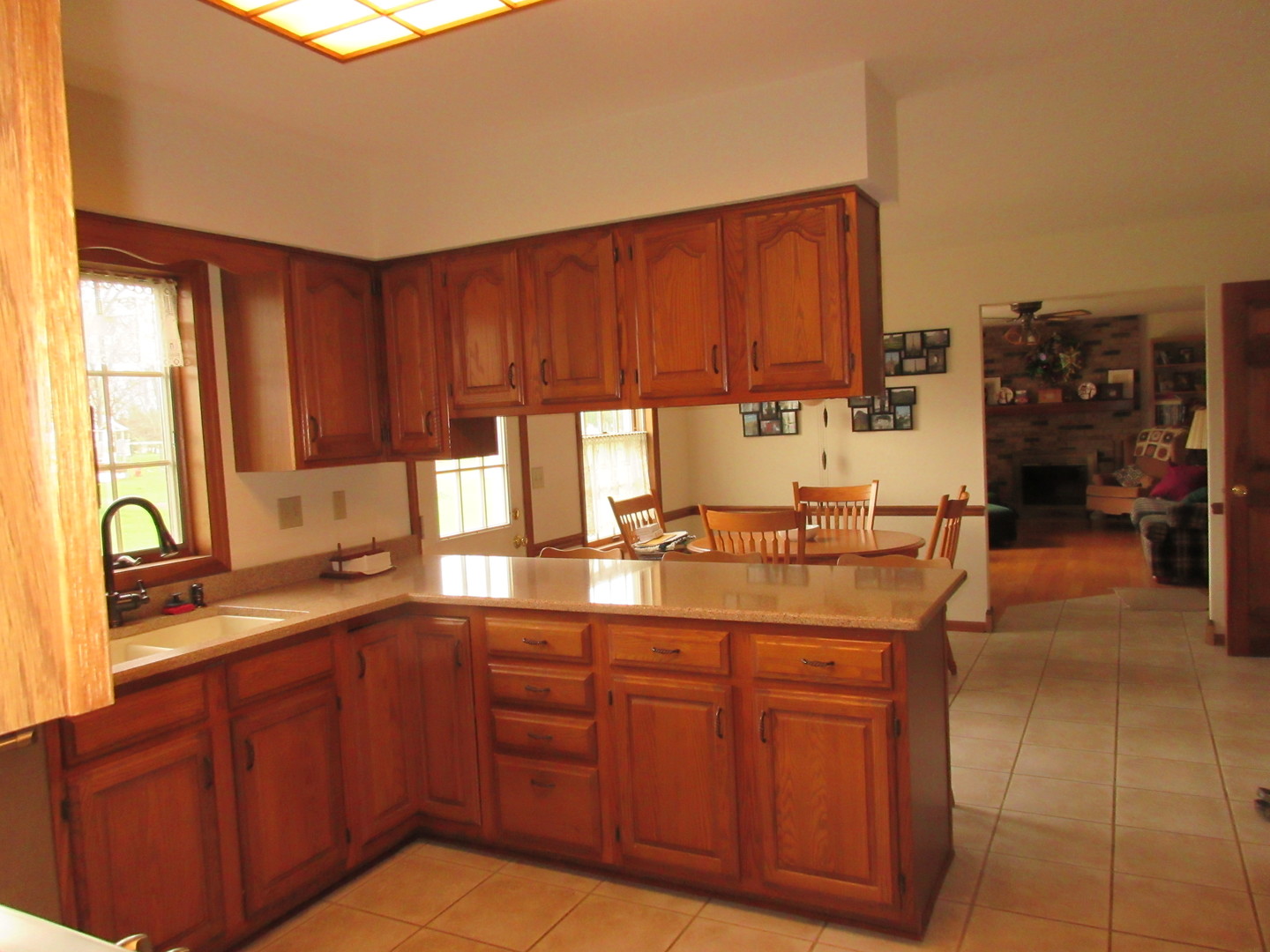 28081 Indian Point Road Sycamore, IL 60178 - Photo 6 of 24 a kitchen with stainless steel appliances granite countertop wooden cabinets a sink and dishwasher