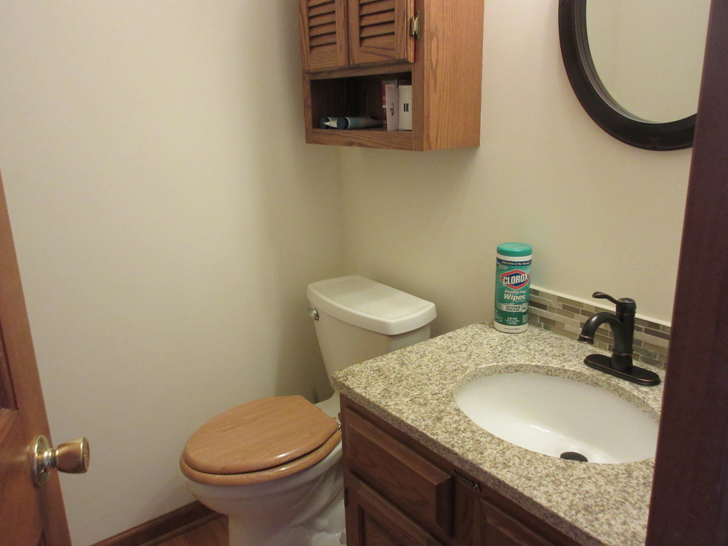 28081 Indian Point Road Sycamore, IL 60178 - Photo 10 of 24 a bathroom with a granite countertop toilet sink and mirror