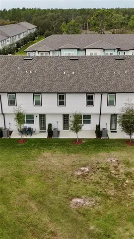 a view of a garden with large trees
