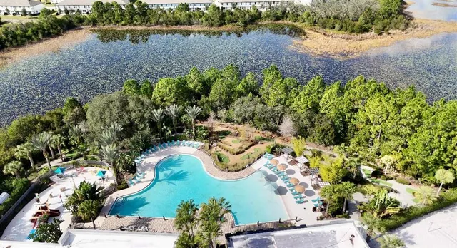 an aerial view of a residential houses with outdoor space