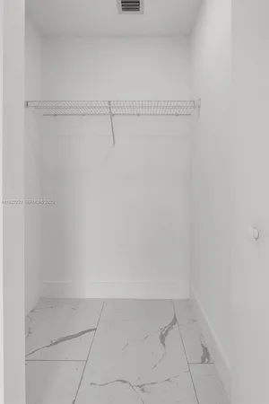 a bathroom with a sink toilet vanity and shower