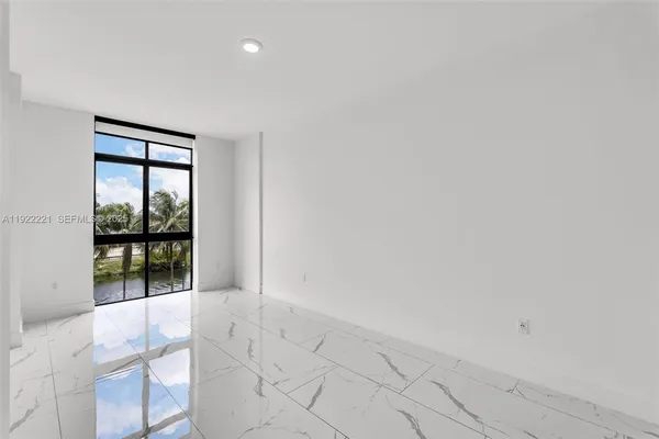 a view of an empty room and window