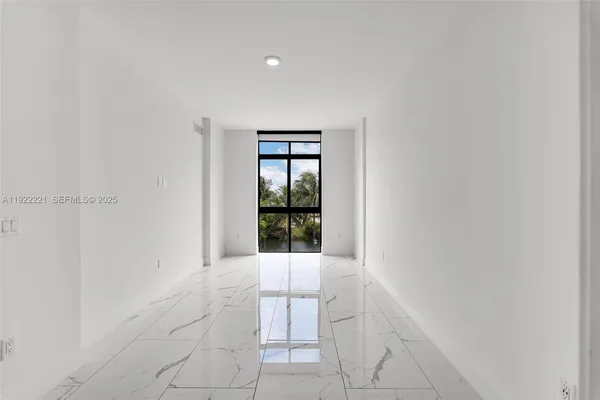 a view of an empty room with window