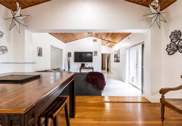 a bedroom with a bed and a mirror