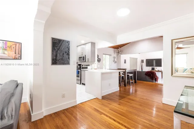 a bathroom with a granite countertop sink mirror toilet and shower