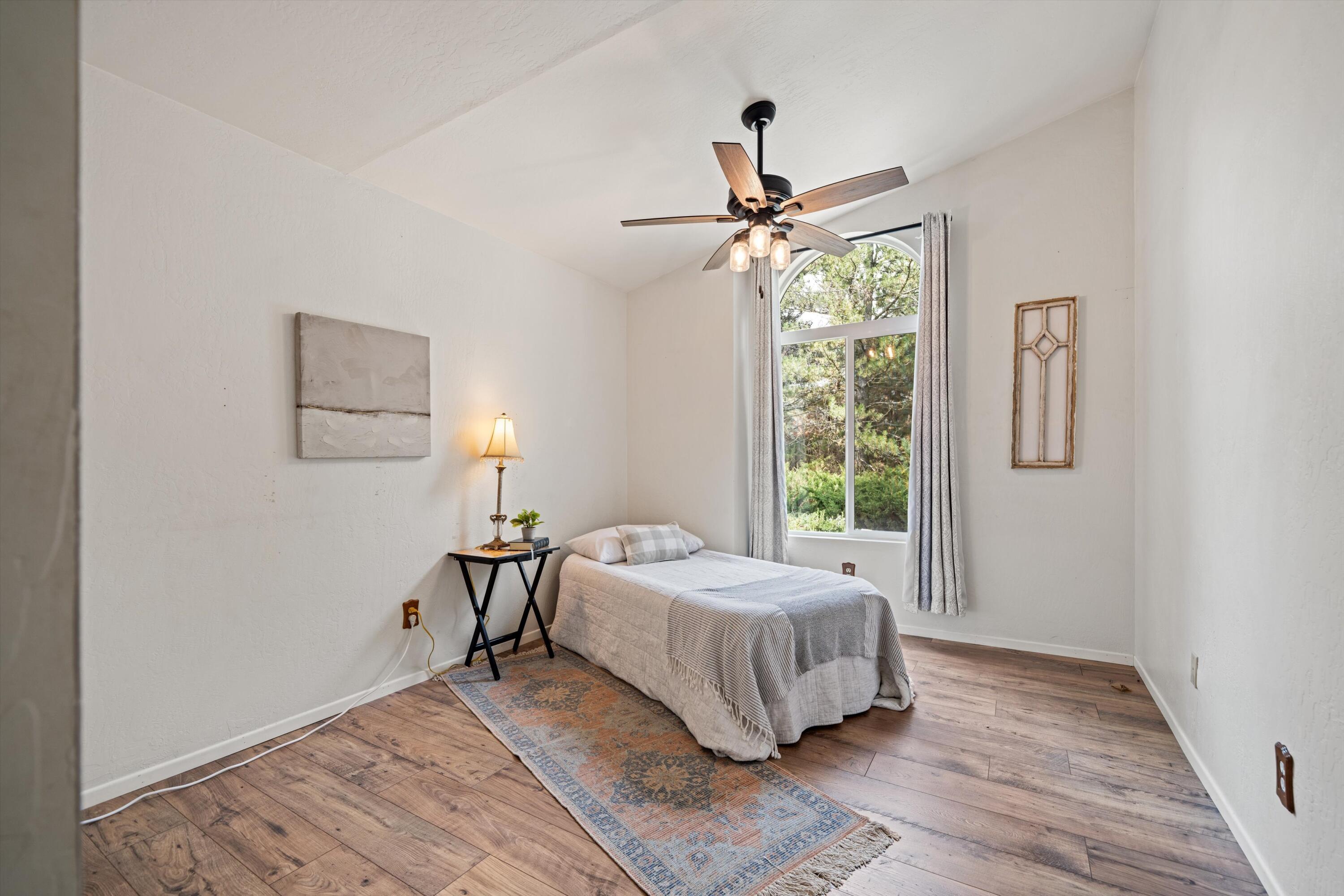 27900 Cummings Valley Road Tehachapi, CA 93561 - Photo 14 of 23 a bedroom with a bed and a window