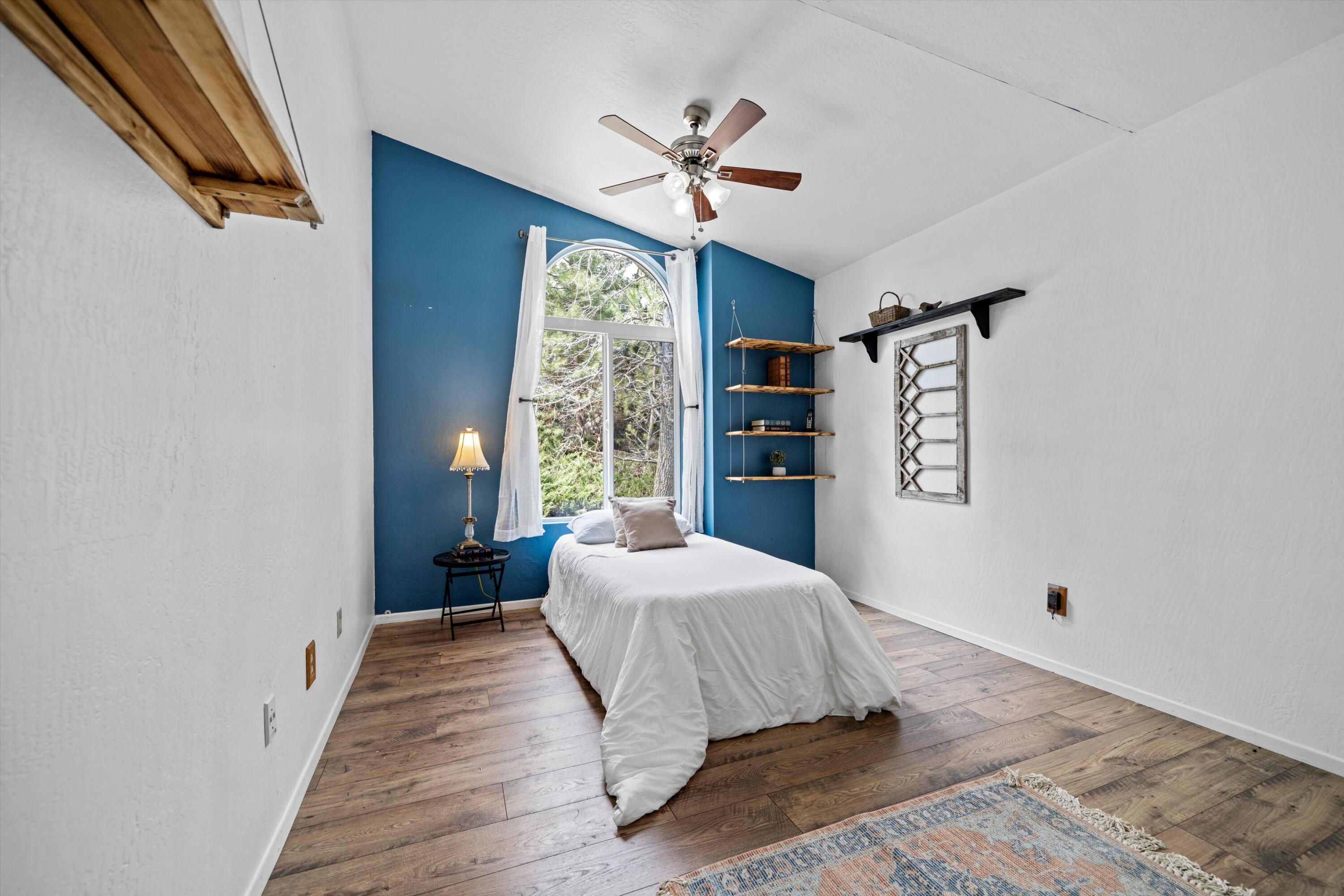27900 Cummings Valley Road Tehachapi, CA 93561 - Photo 15 of 23 a bedroom with a bed and a window