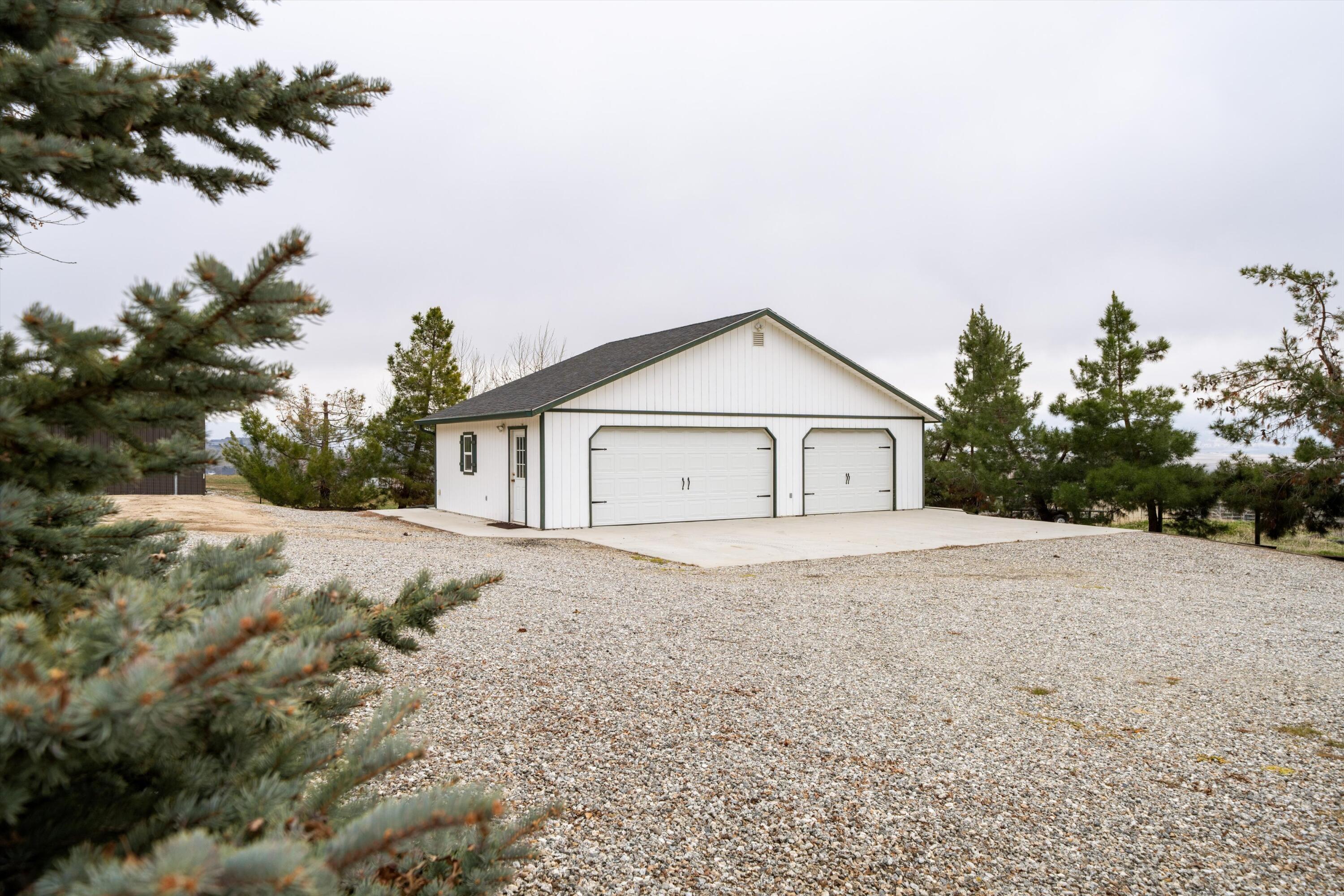 27900 Cummings Valley Road Tehachapi, CA 93561 - Photo 3 of 23 a view of house with outdoor space and trees in the background