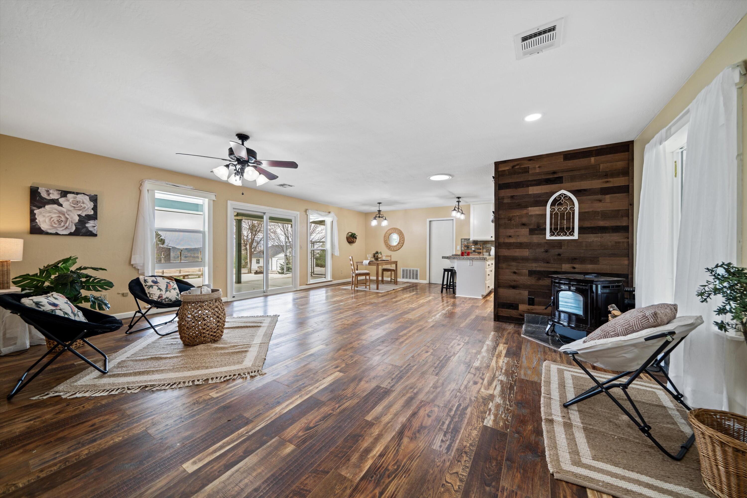 27900 Cummings Valley Road Tehachapi, CA 93561 - Photo 4 of 23 a living room with furniture and a fireplace