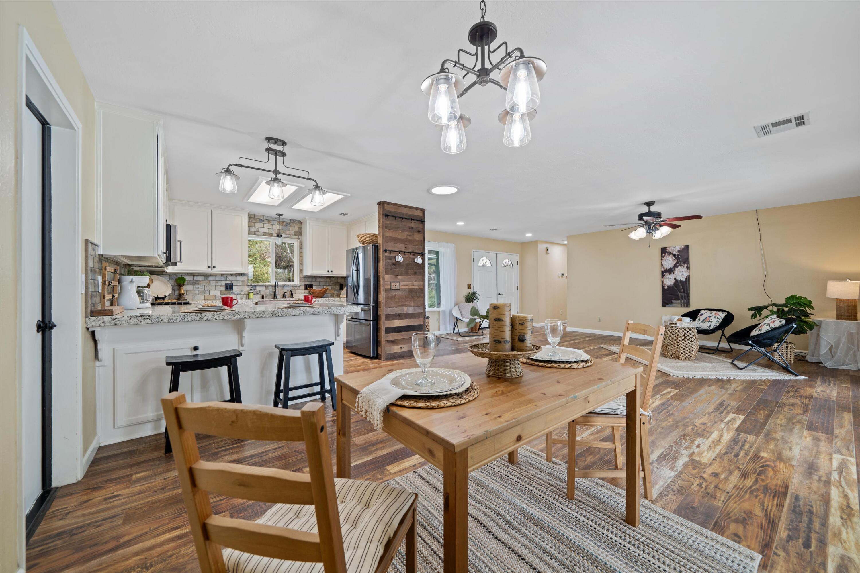 27900 Cummings Valley Road Tehachapi, CA 93561 - Photo 8 of 23 a view of a dining room with furniture and a chandelier