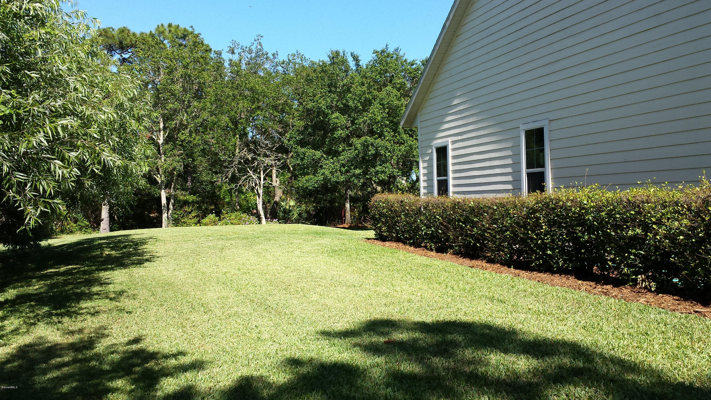 4243 Turtle Mound Road Melbourne, FL 32934 - Photo 24 of 25 Beautifully Kept Yard