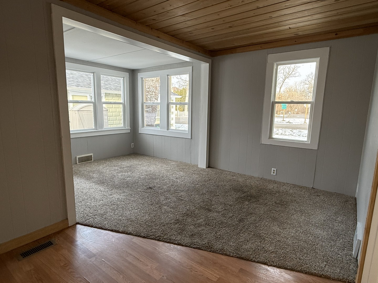 3717 State Line Road, Unit B Richmond, IL 60071 - Photo 12 of 20 an empty room with wooden floor and windows