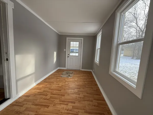 a view of an empty room and window