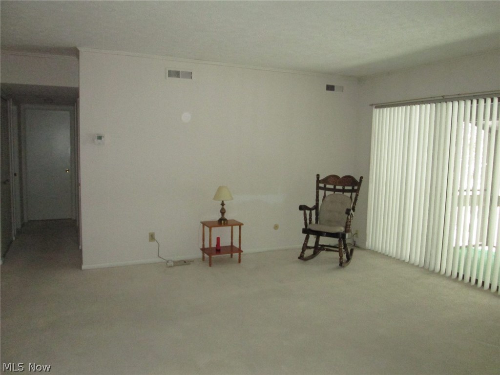 Living room with access to the enclosed screened in porch(8 x 14).