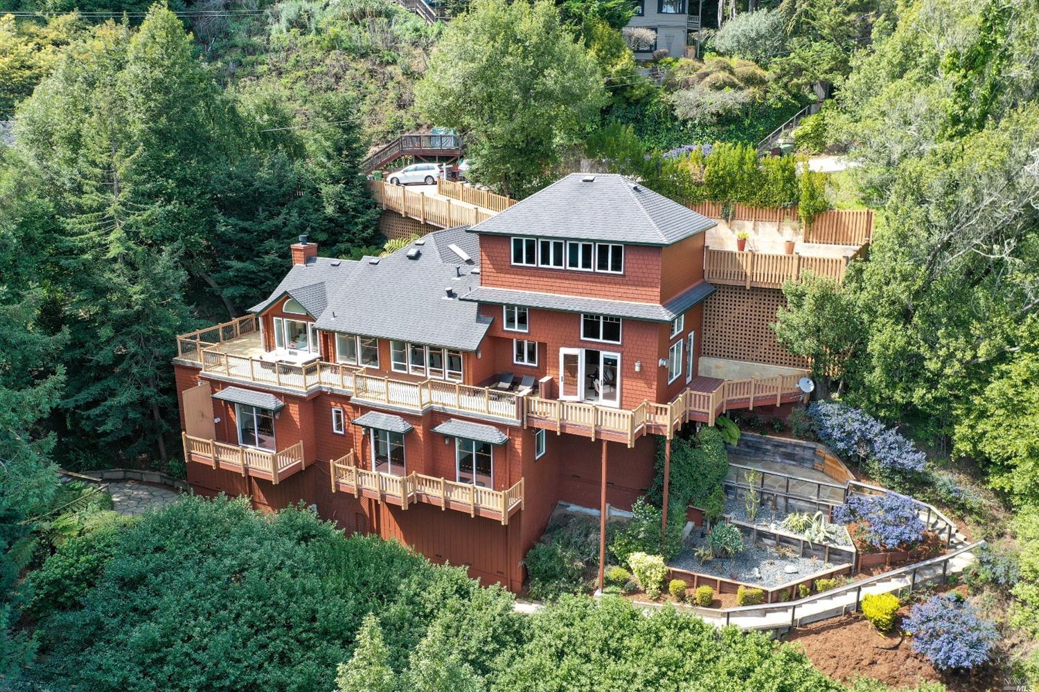 an aerial view of a house with yard patio and barbeque oven