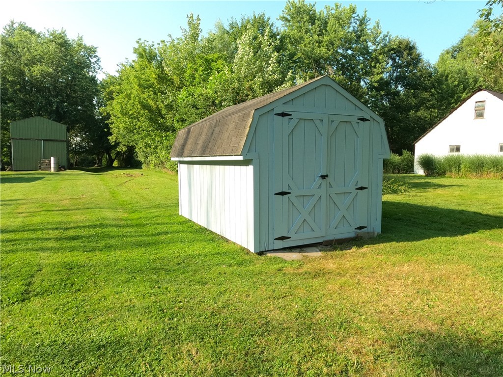 1425 Eastern Road Rittman, OH 44270 - Photo 18 of 28 View of shed / structure featuring a yard