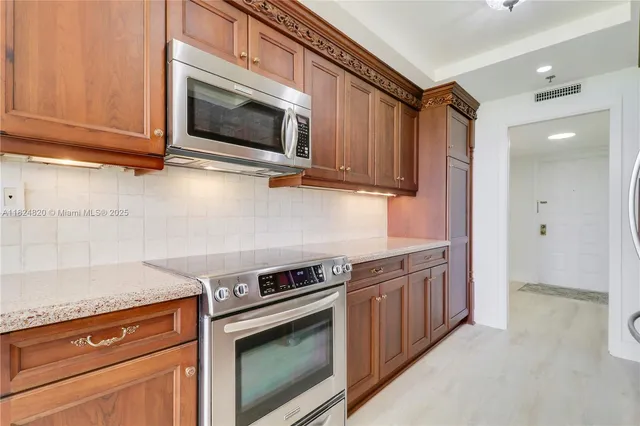 a bedroom with a bed and a flat screen tv in it
