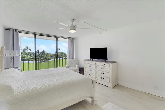 a view of a dining room with furniture and a kitchen