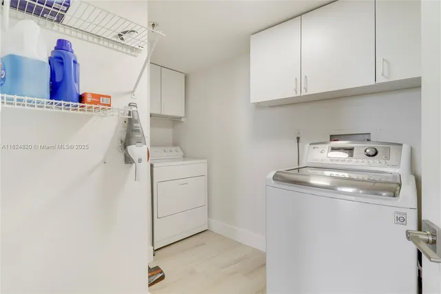 a living room with furniture and a book shelf