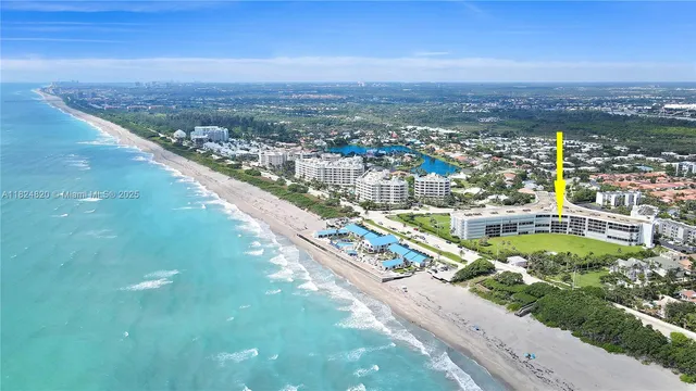 a kitchen with stainless steel appliances granite countertop a refrigerator and a stove