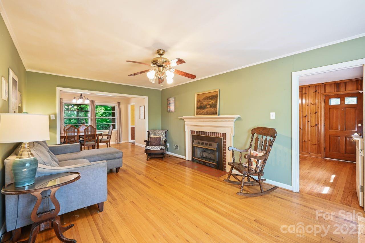 3710 Benjamin Street Richburg, SC 29729 - Photo 16 of 35 a living room with furniture a fireplace and a table