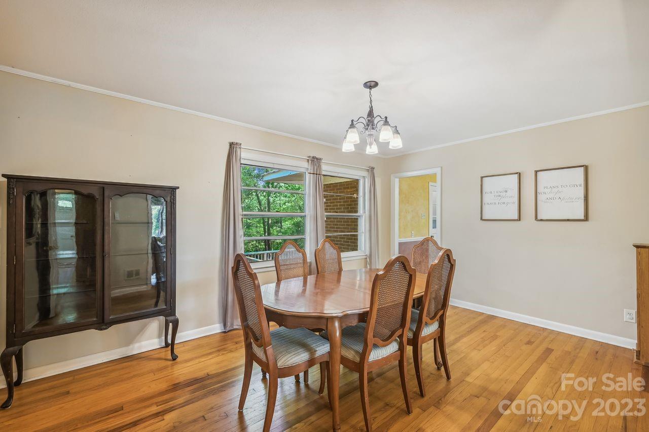 3710 Benjamin Street Richburg, SC 29729 - Photo 21 of 35 a view of a dining room with furniture wooden floor and chandelier