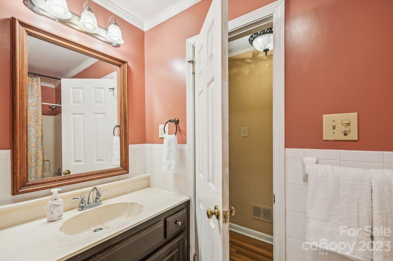 3710 Benjamin Street Richburg, SC 29729 - Photo 23 of 35 a bathroom with a sink vanity and a mirror
