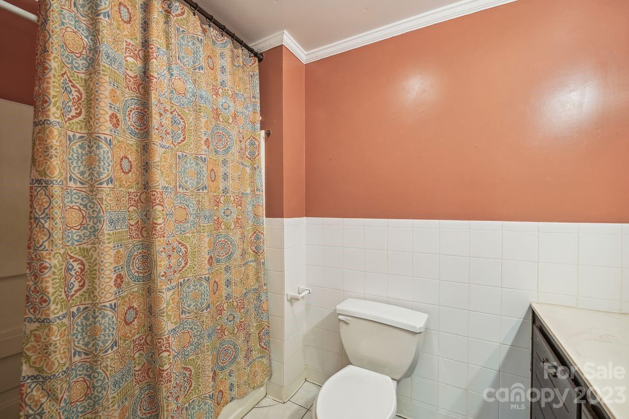 3710 Benjamin Street Richburg, SC 29729 - Photo 24 of 35 a bathroom with a toilet and a shower curtain