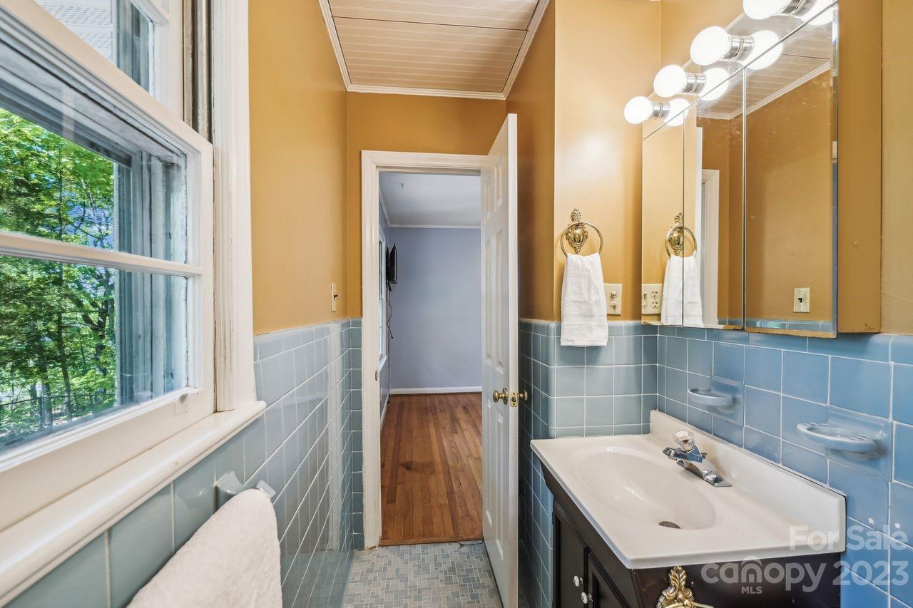 3710 Benjamin Street Richburg, SC 29729 - Photo 32 of 35 a bathroom with a sink a vanity and a mirror