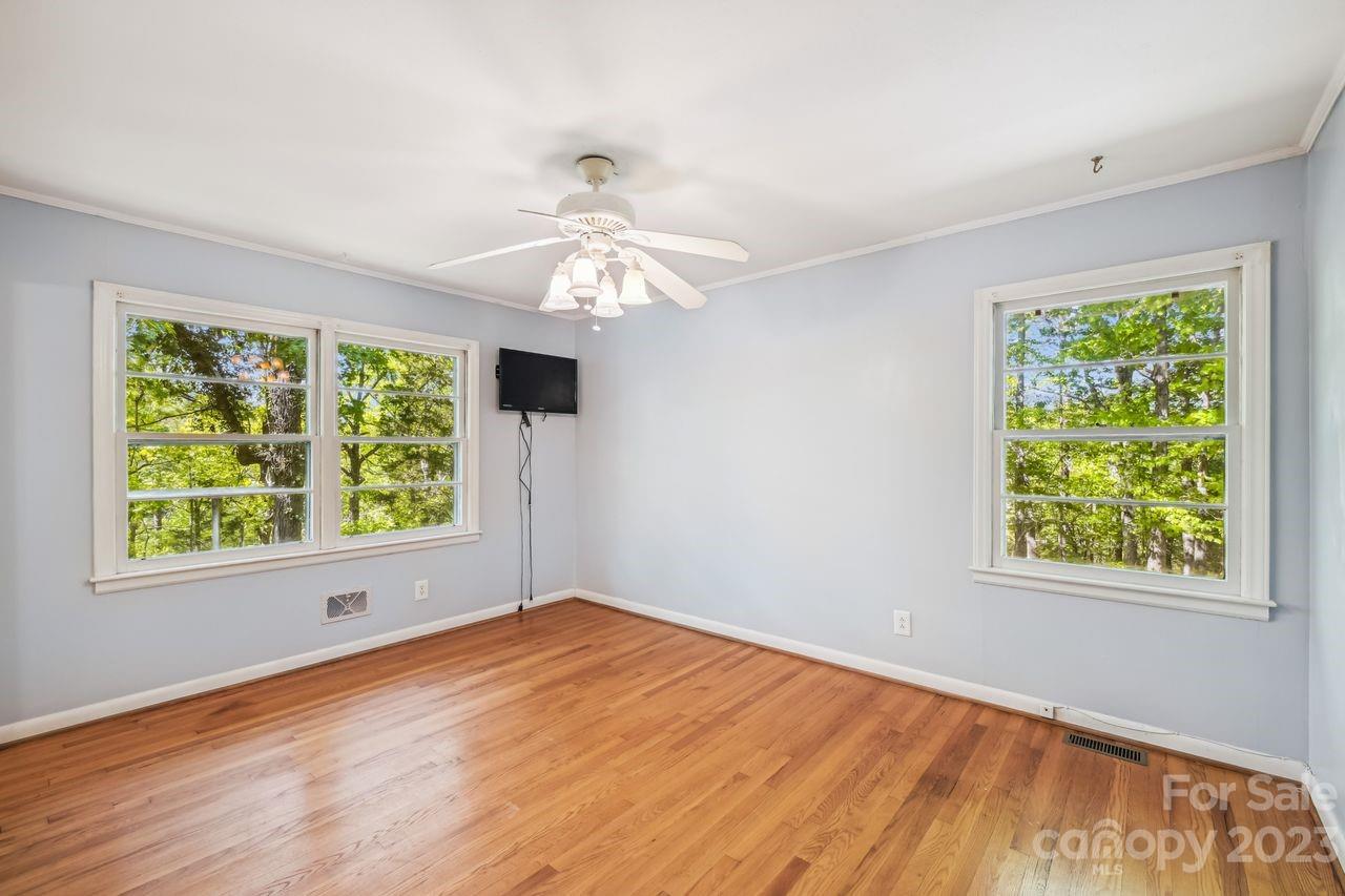 3710 Benjamin Street Richburg, SC 29729 - Photo 33 of 35 a view of an empty room with wooden floor and a window