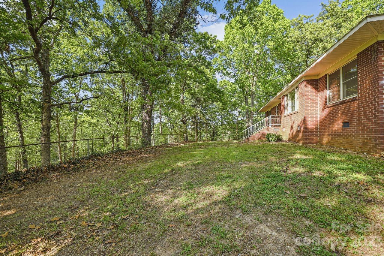 3710 Benjamin Street Richburg, SC 29729 - Photo 7 of 35 a backyard of a house with lots of green space