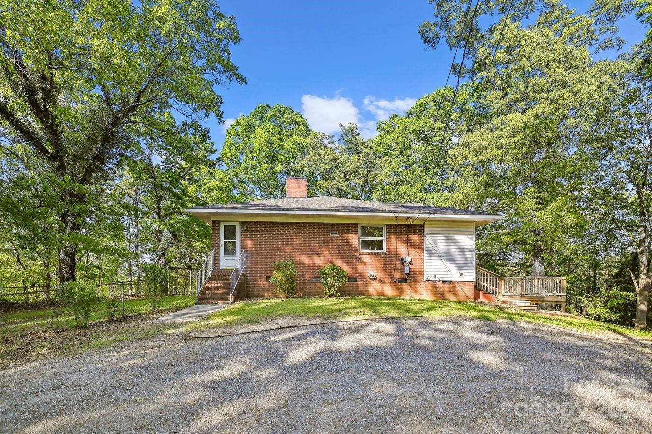 3710 Benjamin Street Richburg, SC 29729 - Photo 8 of 35 a front view of a house with garden