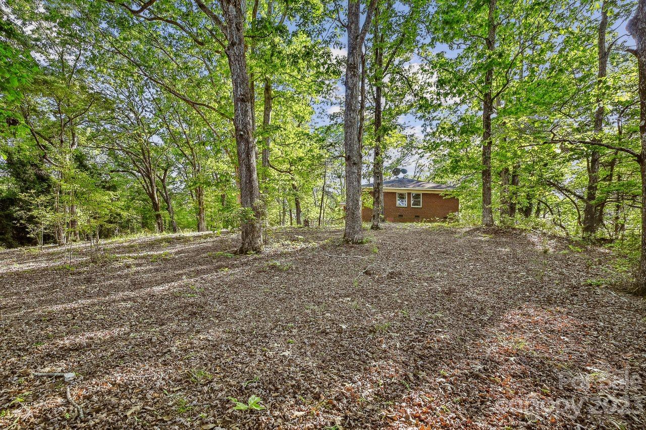 3710 Benjamin Street Richburg, SC 29729 - Photo 10 of 35 a view of a house with large trees
