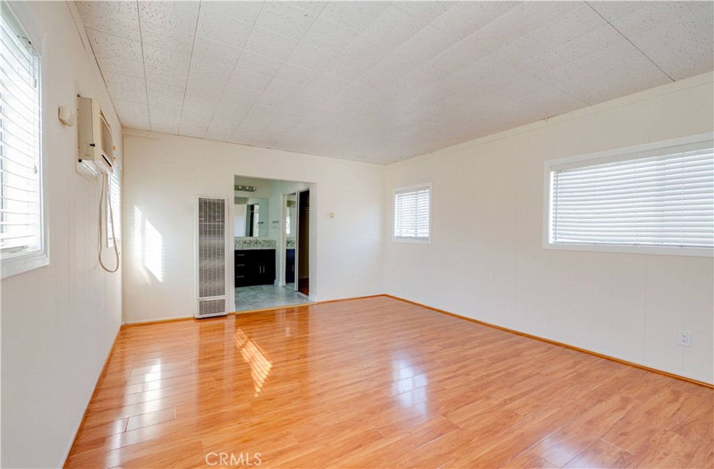 9816 Key W Street Temple City, CA 91780 - Photo 11 of 15 a view of an empty room with window and wooden floor