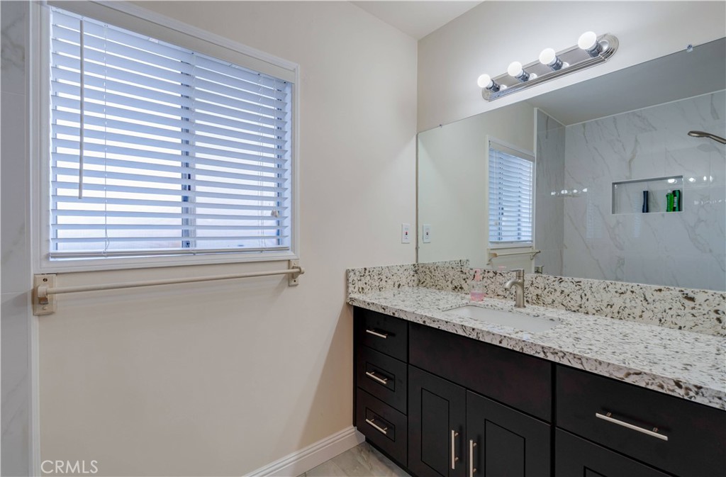 9816 Key W Street Temple City, CA 91780 - Photo 7 of 15 a bathroom with a granite countertop sink and a window