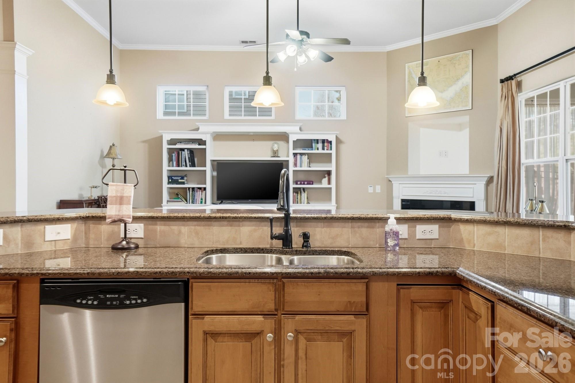 425 Silver Cypress Lane Fort Mill, SC 29708 - Photo 12 of 40 a kitchen with stainless steel appliances granite countertop a sink and a microwave