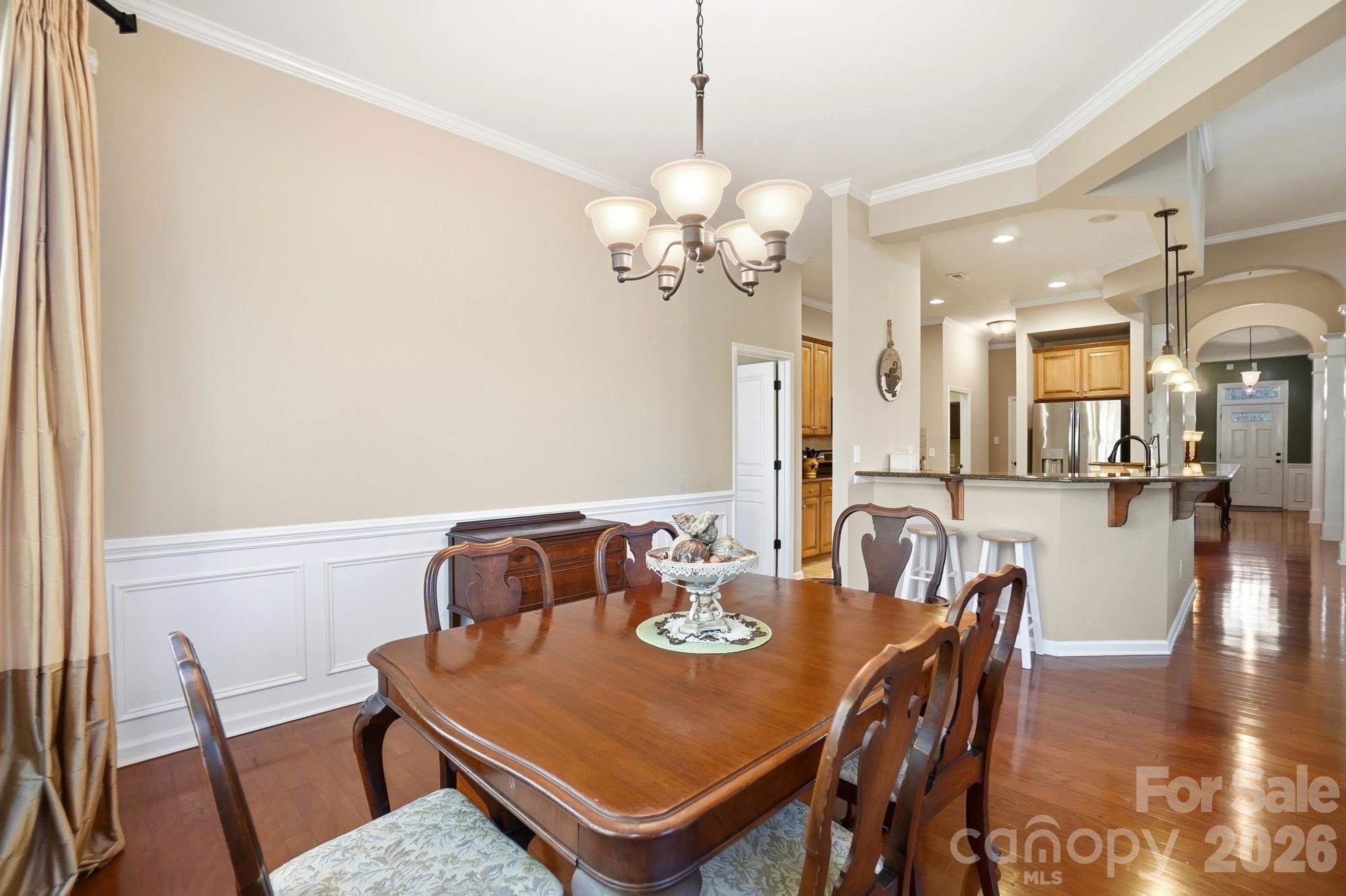 425 Silver Cypress Lane Fort Mill, SC 29708 - Photo 15 of 40 a view of a dining room with furniture and wooden floor