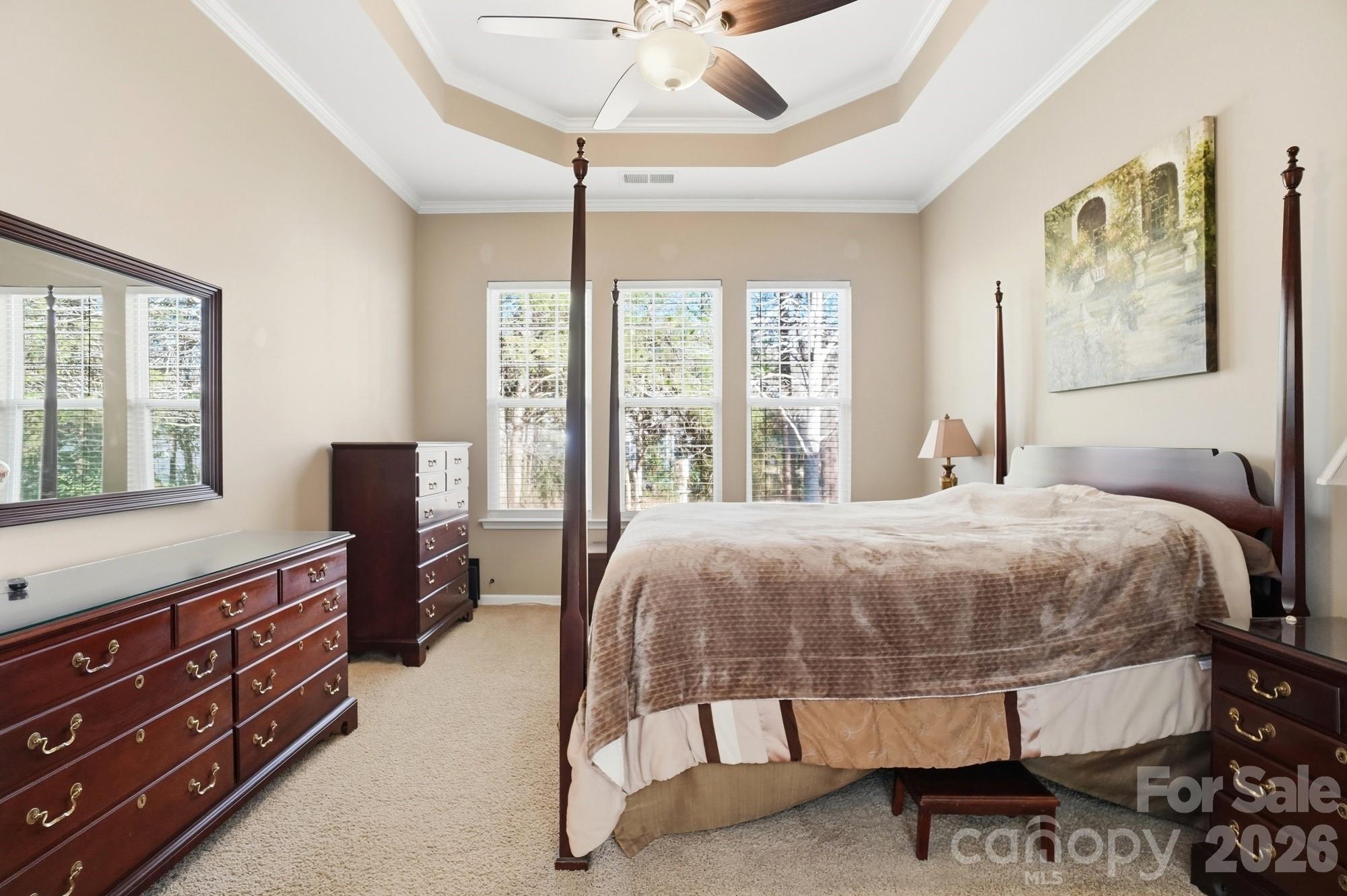 425 Silver Cypress Lane Fort Mill, SC 29708 - Photo 18 of 40 a bedroom with a bed and wooden floor