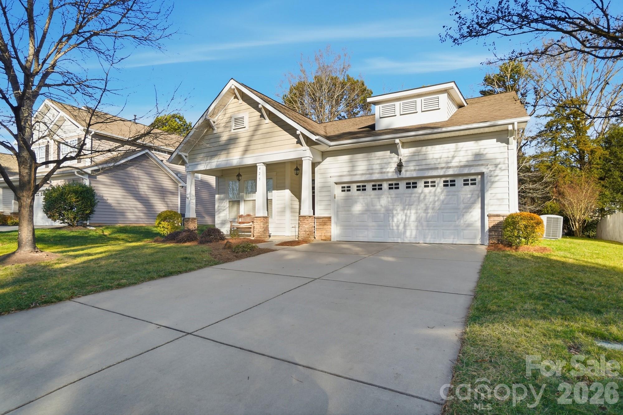 425 Silver Cypress Lane Fort Mill, SC 29708 - Photo 2 of 40 a front view of a house with garden