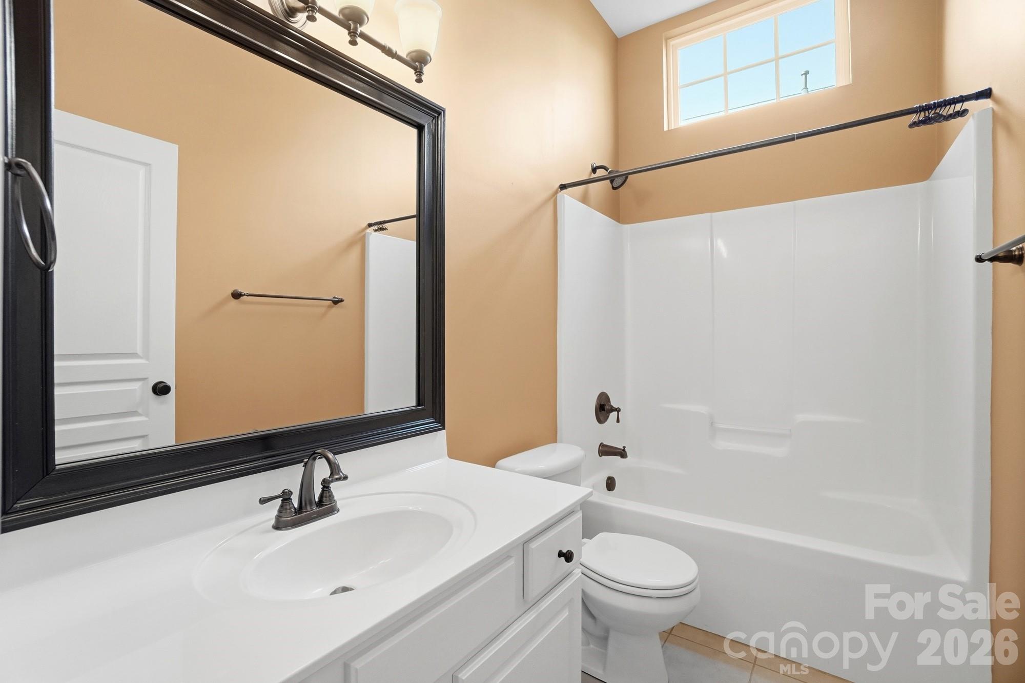 425 Silver Cypress Lane Fort Mill, SC 29708 - Photo 26 of 40 a bathroom with a sink a toilet and shower